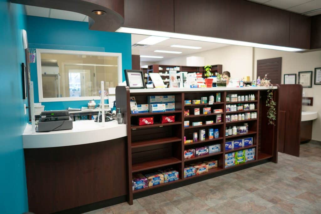 Pharmacy counter and product aisles at Sioux pharmacy.